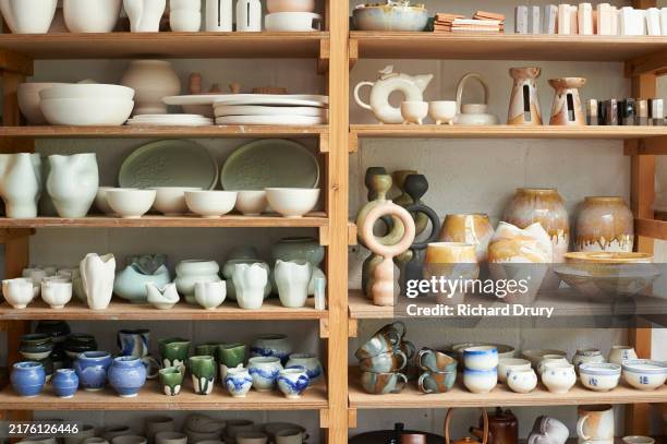 ceramics on a shelf in a pottery workshop - ceramic stock pictures, royalty-free photos & images