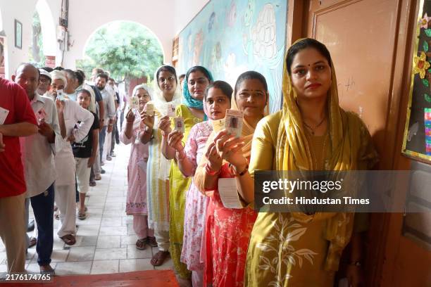 Voters in Rohtak Assembly Constituency waiting in queue for their turn to exercise their franchise in General Election to Assembly, on October 5,...