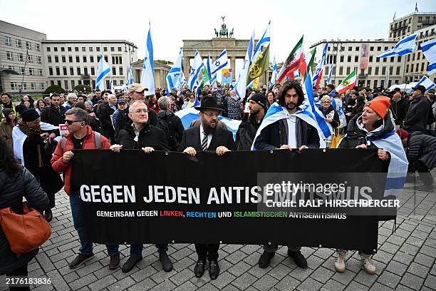Rabbi Yehuda Teichtal together with demonstrators displays a banner with the lettering 'Against all anti-Semitism, together against anti-Semitism...