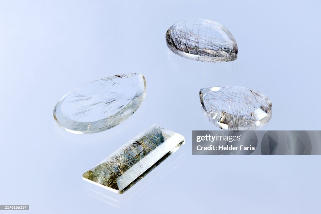Rutilated quartz in different shapes, drop and rectangular
