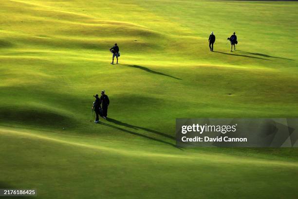 The late starters in final practice reach the 18th green on The Old Course prior to the Alfred Dunhill Links Championship 2024 at the Old Course at...