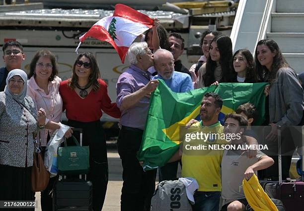 Brazil's President Luiz Inacio Lula Da Silva and First Lady Rosangela 'Janja' Da Silva welcome Brazilian citizens fleeing the conflict between Israel...