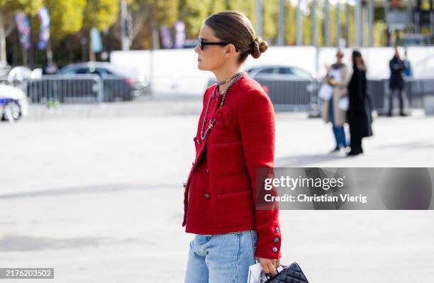 Guest wears red jacket outside Chanel during Womenswear Spring/Summer 2025 as part of Paris Fashion Week on October 01, 2024 in Paris, France.