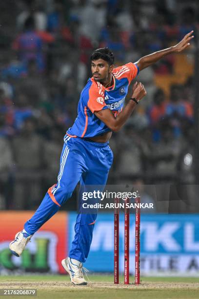 India's Washington Sundar bowls during the first Twenty20 cricket match between India and Bangladesh at the Shrimant Madhavrao Scindia Cricket...