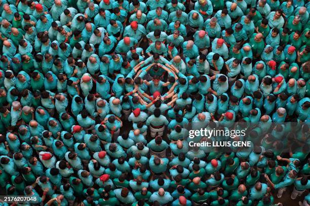 Members of the "Castellers de Vilafranca" team form a 'castell' during the 26th Castells Competetion in Tarragona on October 6, 2024. The human...