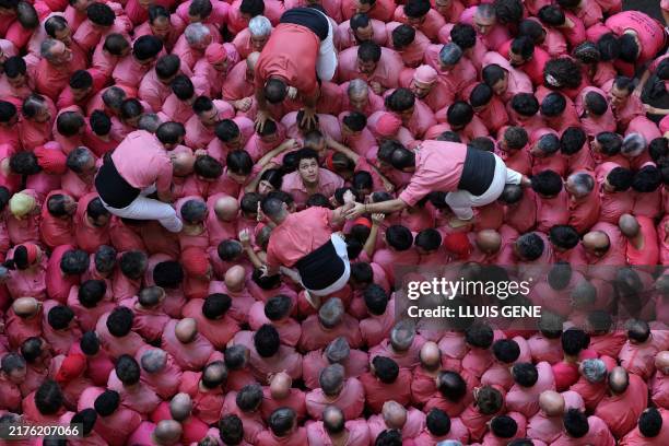 Members of the "Colla Vella dels Xiquets de Valls" team form a 'castell' during the 26th Castells Competetion in Tarragona on October 6, 2024. The...