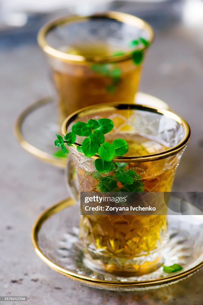 Tea with mint in a traditional Turkish glass cup