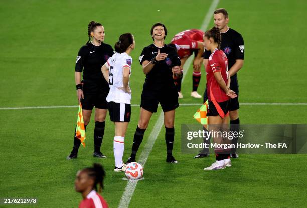 Niamh Fahey of Liverpool and Maya Le Tissier of Manchester United observe the coin toss prior to the Women's League Cup match between Manchester...