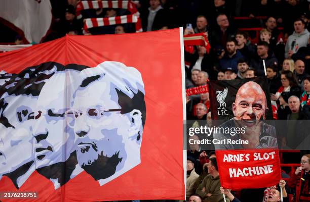Fans hold up banners of Arne Slot, Manager of Liverpool, and previous managers during the UEFA Champions League 2024/25 League Phase MD2 match...