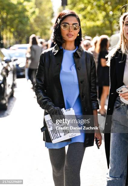 Guest is seen wearing a Miu Miu jacket and hair clips outside the Miu Miu show during Womenswear Spring/Summer 2025 as part of Paris Fashion Week on...