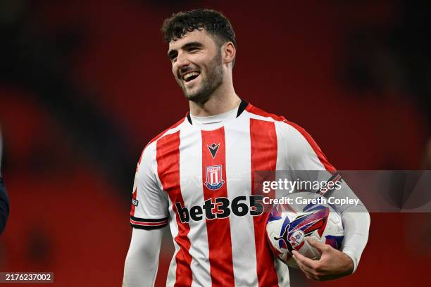 Thomas Cannon of Stoke celebrates with the match ball after winning the Sky Bet Championship match between Stoke City FC and Portsmouth FC at Bet365...