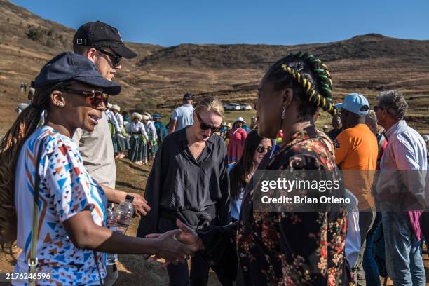 Board Chair Dr. Sophie Chandauka MBE, a guest and Stacey Boyd, Founder & CEO Olivela are welcomed by the community leader as they arrive at Matlameng...