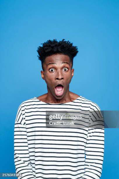 shock, afro american staring at camera with mouth open - terrified stock pictures, royalty-free photos & images