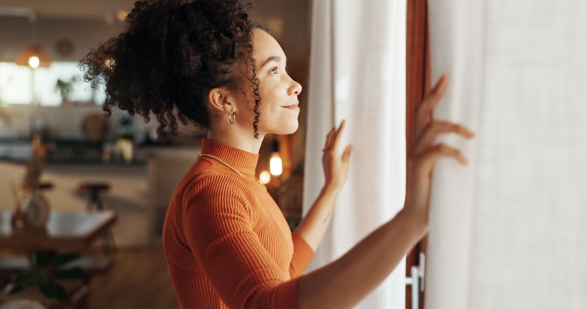 Curtains, happy woman and thinking of future in home, planning and reflection of mindset with view. Window, smile and African girl with vision, ideas and dream for morning inspiration in living room Curtains, happy woman and thinking of future in home, planning and reflection of mindset with view. Window, smile and African girl with vision, ideas and dream for morning inspiration in living room
