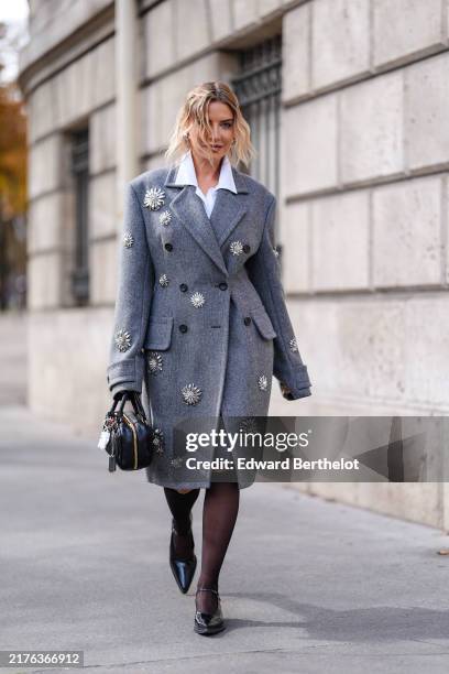 Veronica Ferraro wears white buttoned up long sleeve shirt, dark gray double breasted tailored Miu MIu blazer coat with silver embroidered detail,...