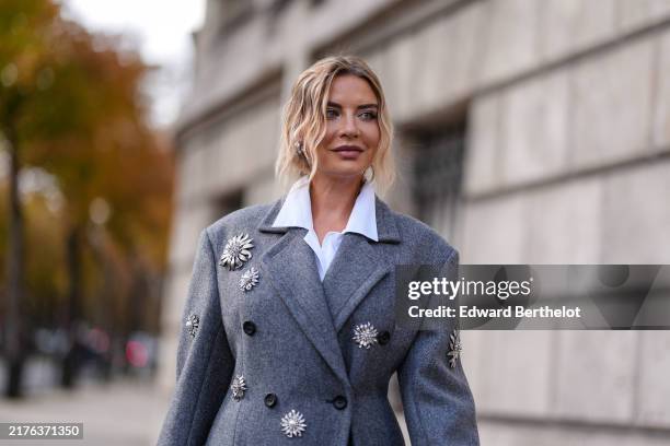 Veronica Ferraro wears white buttoned up long sleeve shirt, dark gray double breasted tailored Miu MIu blazer coat with silver embroidered detail,...