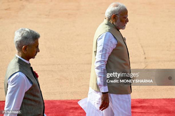 India's Prime Minister Narendra Modi and Foreign Minister Subrahmanyam Jaishankar walk before the ceremonial reception of Maldives President Mohamed...