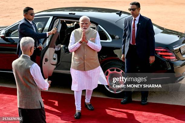 India's Foreign Minister Subrahmanyam Jaishankar greets Prime Minister Narendra Modi upon his arrival for the ceremonial reception of Maldives...