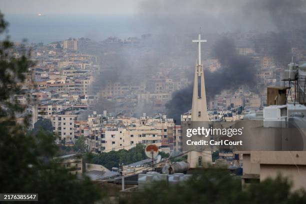 Smoke rises from overnight Israeli airstrikes on October 6, 2024 in Beirut, Lebanon. Hundreds of thousands of people have fled Lebanon in recent...