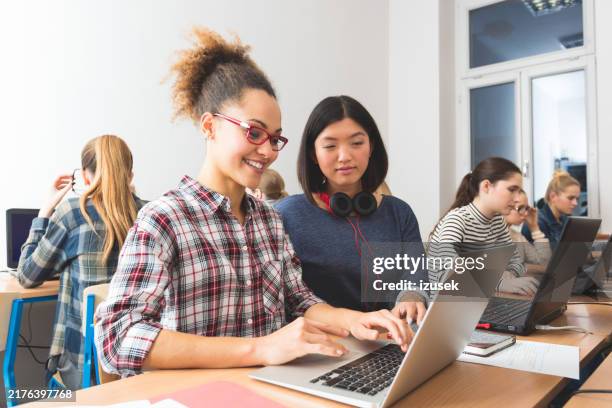 young women learning computer programming - girls coding stock pictures, royalty-free photos & images
