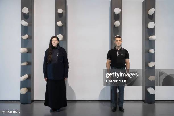 Serbian conceptual artist Marina Abramovic poses in a new artwork embedded with crystals, which Abramovic believes contain energy, with Shai Baitel,...