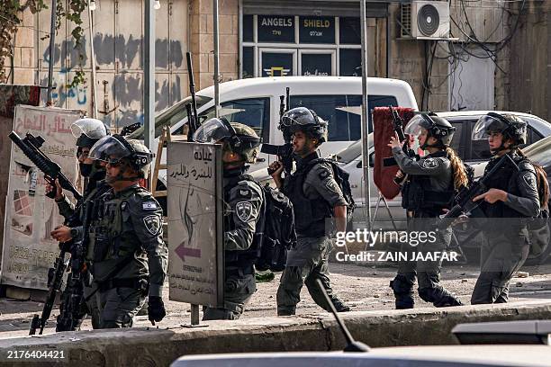 Israeli forces deploy during a military raid in Kafr Aqab east of Ramallah in the occupied West Bank on October 7, 2024. Violence in the Israeli...