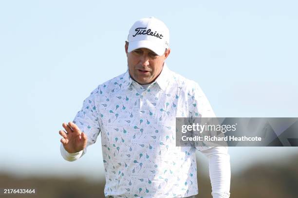 Darren Fichardt of South Africa acknowledges the crowd following a birdie putt on the ninth green during day one of the Alfred Dunhill Links...