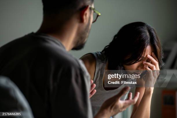 young asian married couple after a fight, angry couple ignoring each other, relationship troubles. - argumentera bildbanksfoton och bilder