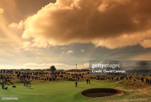Colour graduated filter used on this image; Rory McIlroy of Northern Ireland and his playing partners, Louis Oosthuizen of South Africa, Johann...