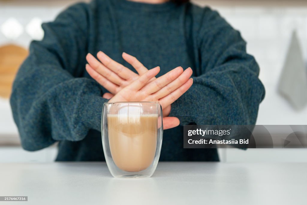 Anonymous woman refusing coffee.Healthy lifestyle concept.