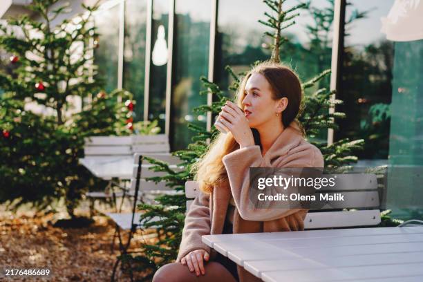 cozy coffee moment outdoors - vitamine d stockfoto's en -beelden