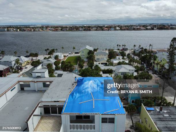 Drone image of a tarp covered apartment complex in the Pass-A-Grille section of St. Petersburg ahead of Hurricane Milton's expected landfall in the...