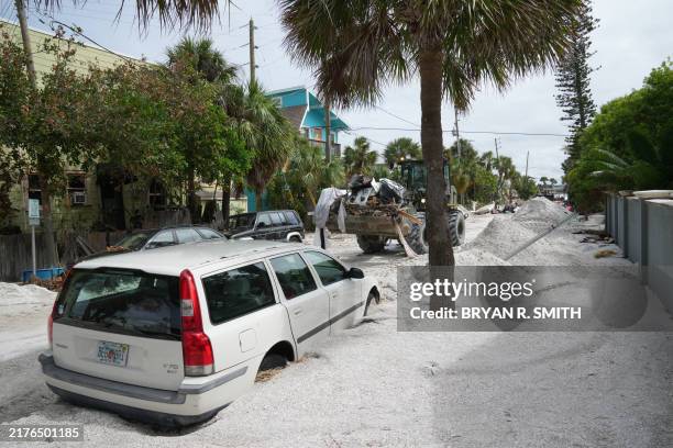 Florida Army National Guard loader moves debris from the Pass-A-Grille section of St. Petersburg ahead of Hurricane Milton's expected landfall in the...