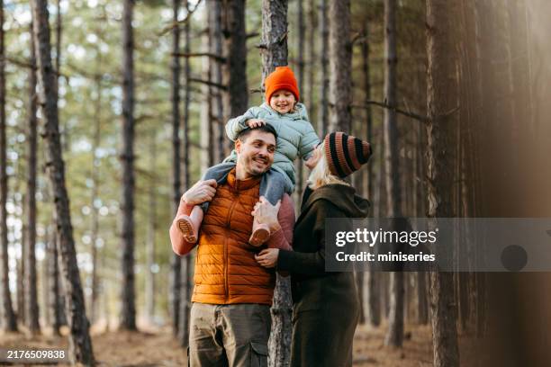 happy family enjoying vacation in mountain forest together - family stock pictures, royalty-free photos & images