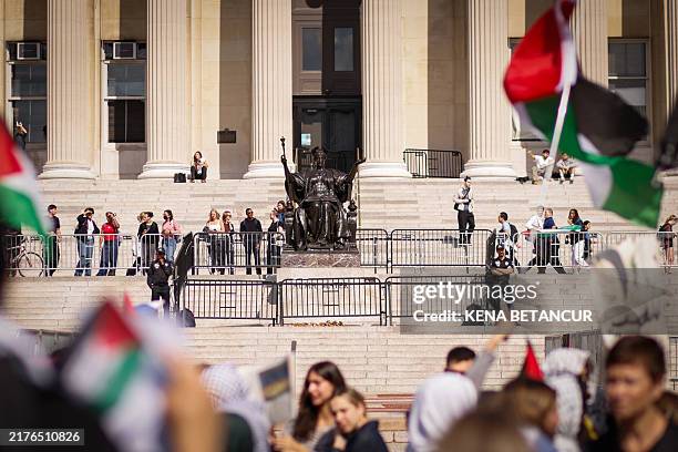 Pro-Palestinian demonstrators march through the Columbia University campus to mark one year of the war between Hamas and Israel in New York City on...
