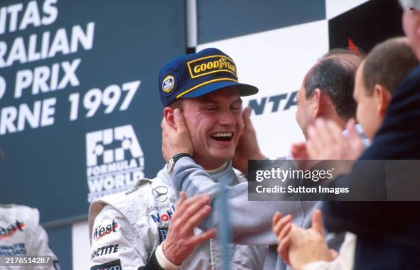 David Coulthard , McLaren MP4-12 1st place on the podium being embraced by Ron Dennis Mclaren Boss Formula One World Championship, Australian Grand...