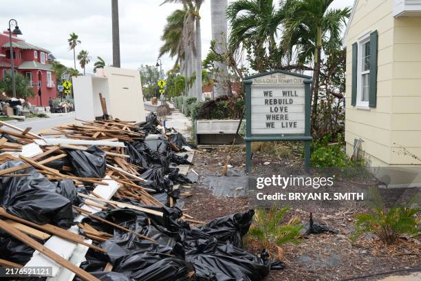 Sign is seen at the Pass-A-Grille Women's Club in St. Petersburg, Florida, ahead of Hurricane Milton's expected landfall in the middle of this week...