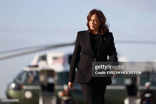 Democratic presidential nominee and Vice President Kamala Harris walks to board Air Force Two as she departs for New York at Joint Base Andrews,...