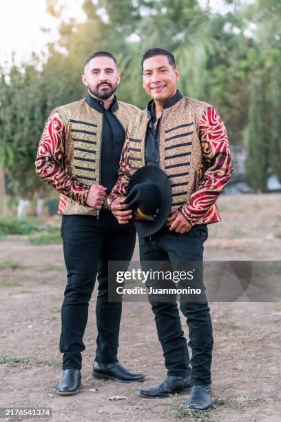 smiling hispanic musicians posing looking at the camera - mexican culture stock pictures, royalty-free photos & images
