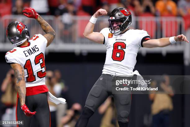 Baker Mayfield of the Tampa Bay Buccaneers celebrates with Mike Evans after a touchdown against the Atlanta Falcons during the second quarter at...