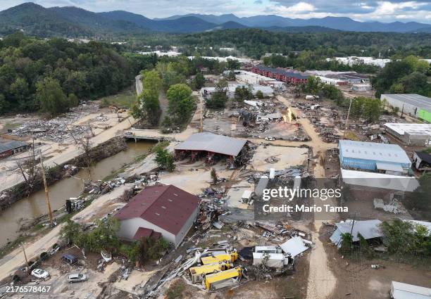 An aerial view of flood damage wrought by Hurricane Helene along the Swannanoa River on October 3, 2024 in Asheville, North Carolina. At least 200...