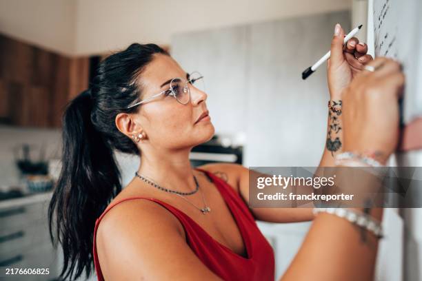 checking the appointment on the wall - best single word stock pictures, royalty-free photos & images