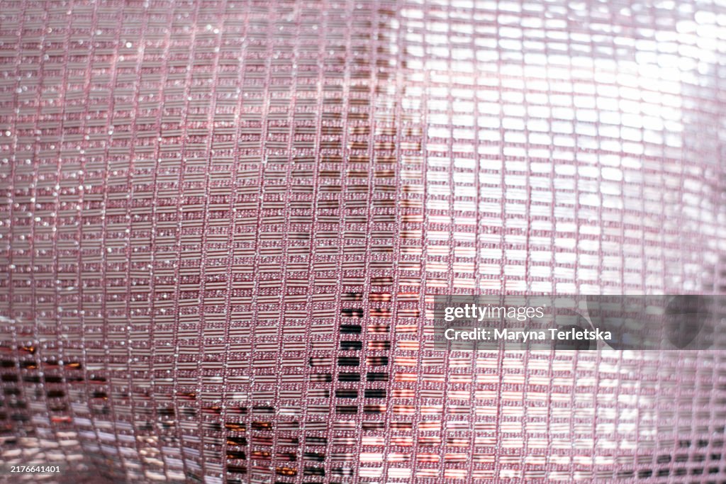 Shiny fabric background. Base. Bright background. Metallic.