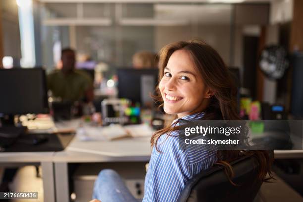 happy female programmer working in the office. - turning stock pictures, royalty-free photos & images