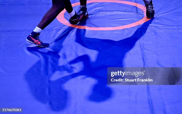 Shadows of wrestlers on the mat as they compete in Men's Wrestling Greco-Roman Wrestling on day two of the Saudi Games 2024 on October 04, 2024 in...