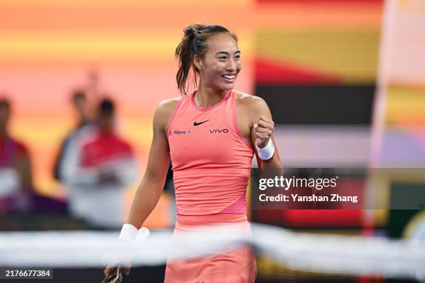 Qinwen Zheng of China celebrates after winning the women's singles quarterfinal match against Mirra Andreeva on Day 12 of the China Open at National...