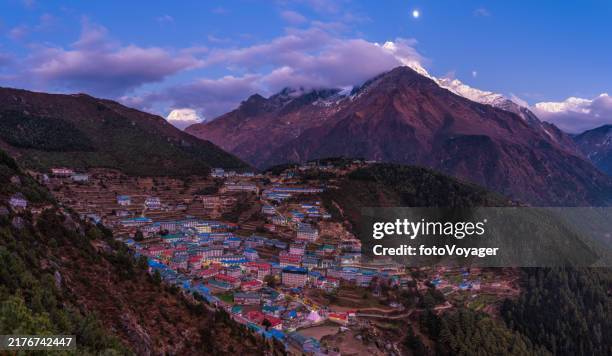 nepal namche bazaar sherpa teahouse village alpenglow moonrise panorama himalayas - namche bazaar stock pictures, royalty-free photos & images