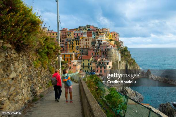 View of the Cinque Terre, a World Heritage List as a 'cultural landscape' that attracts visitors with its natural beauty and colorful structures in...