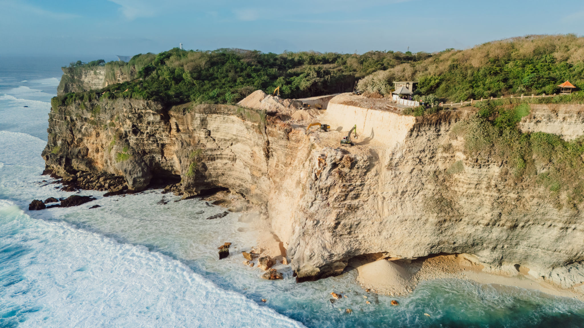 Escalators digging the cliff in Uluwatu, Bali. Aerial drone view Escalators digging the cliff in Uluwatu, Bali. Aerial drone view