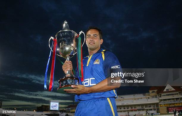 Adam Hollioake, the Surrey captain, celebrates with the trophy after beating Warwickshire in the Surrey v Warwickshire Final of the Twenty20...